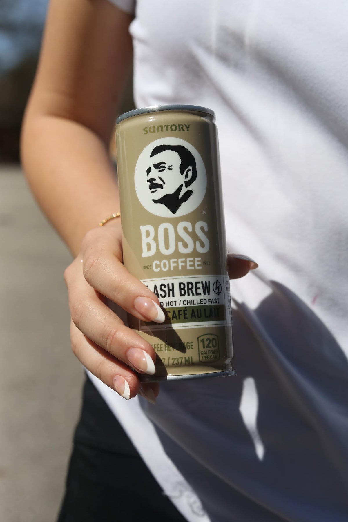 BOSS Coffee with milk in a mug emphasizes creamy body and balanced flavor.