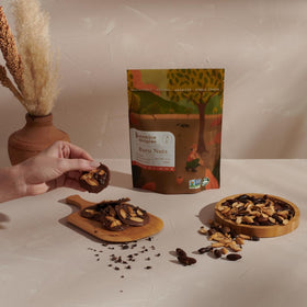Botanica Origins Baru Nuts wild harvested kernels in a rustic display for trail mix