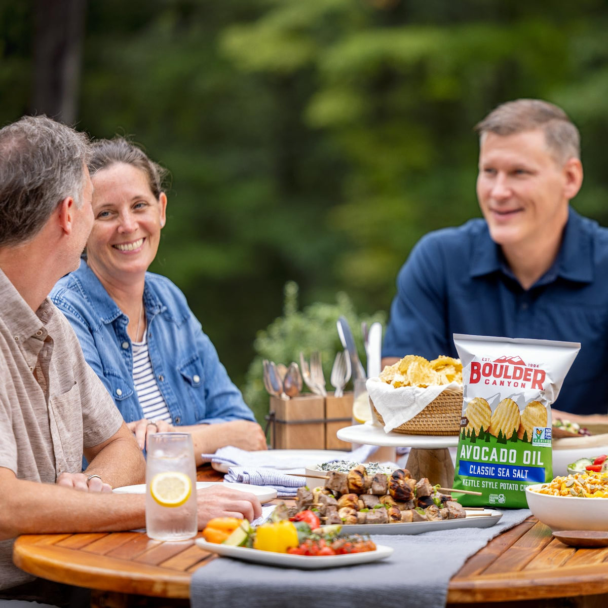 Boulder Canyon avocado-oil chips on a snack board, ready to share.