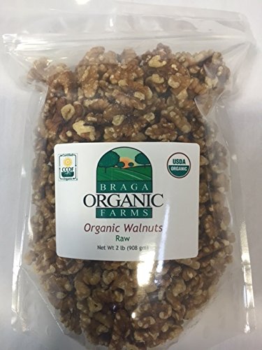 Snack-ready handful of Braga Organic Farms walnuts, ideal on the go.