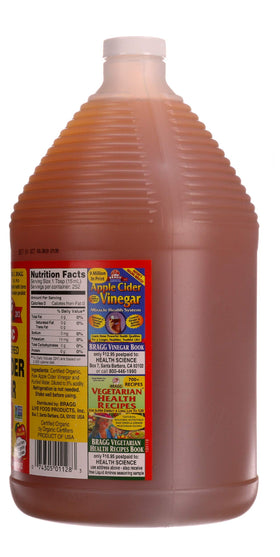 Bragg Apple Cider Vinegar poured into a glass with water for a daily sip.