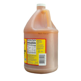 Bragg Apple Cider Vinegar bottle pouring, highlighting The Mother for natural flavor.