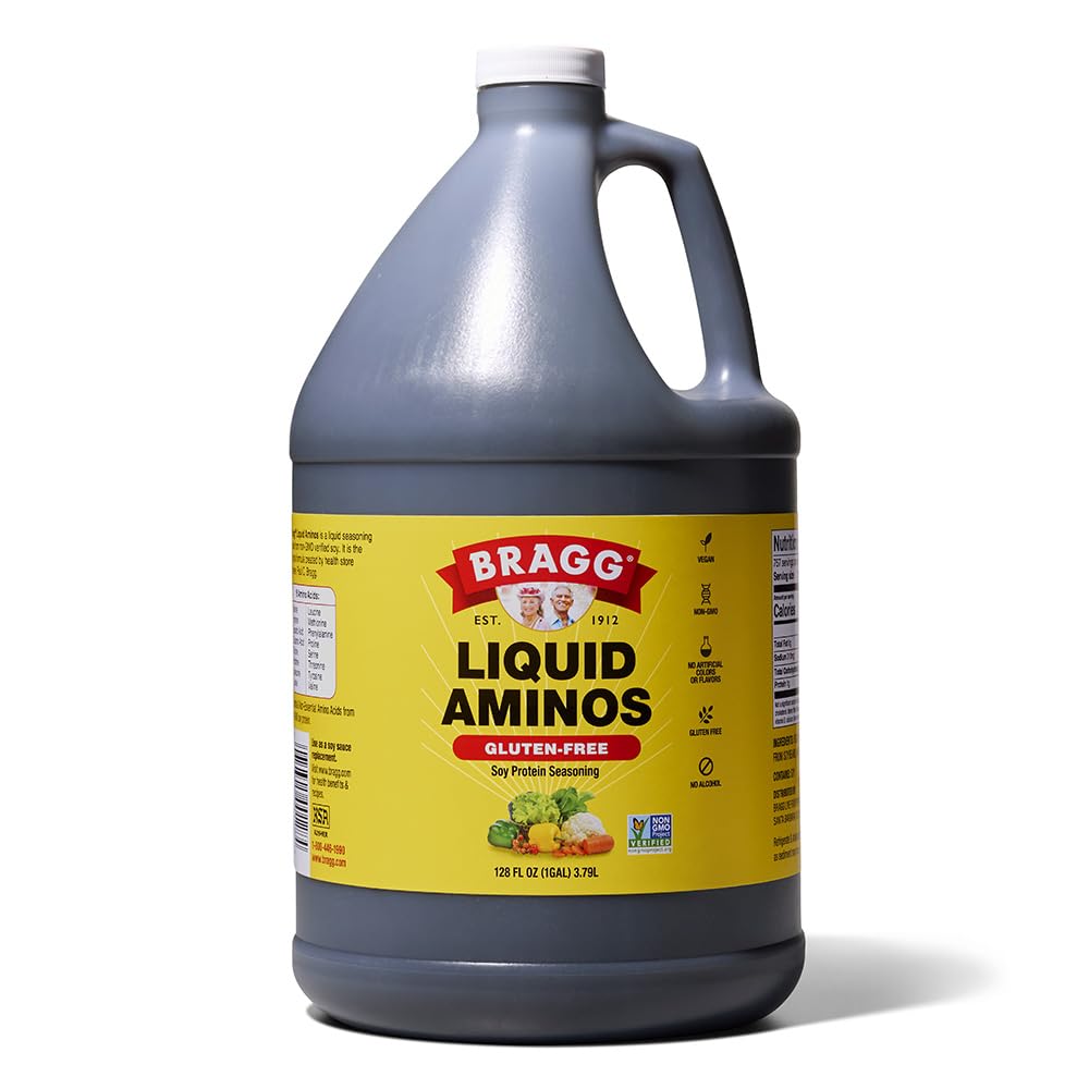 Bragg Liquid Aminos bottle pouring, gluten-free seasoning for stir-fries.