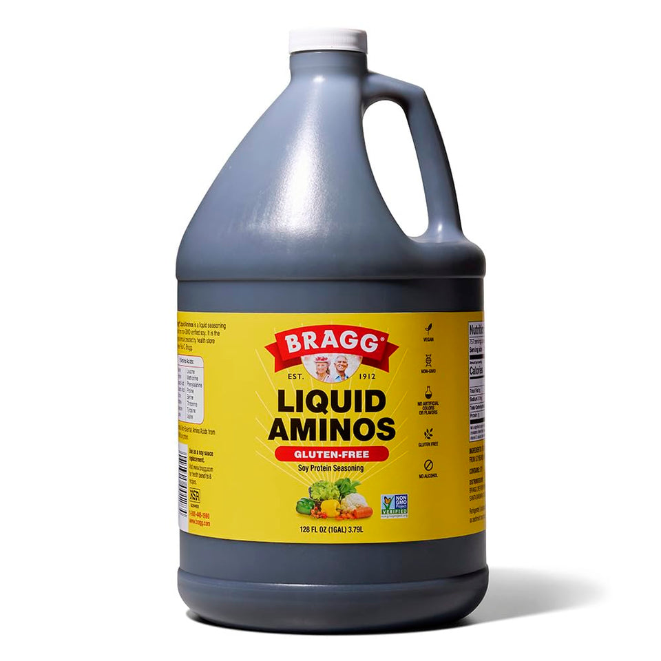 Bragg Liquid Aminos bottle pouring, gluten-free seasoning for stir-fries.