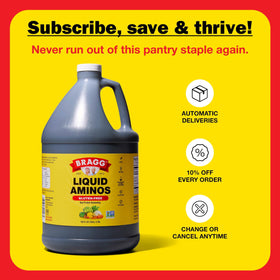 Bragg Liquid Aminos on kitchen counter, non-GMO seasoning option.