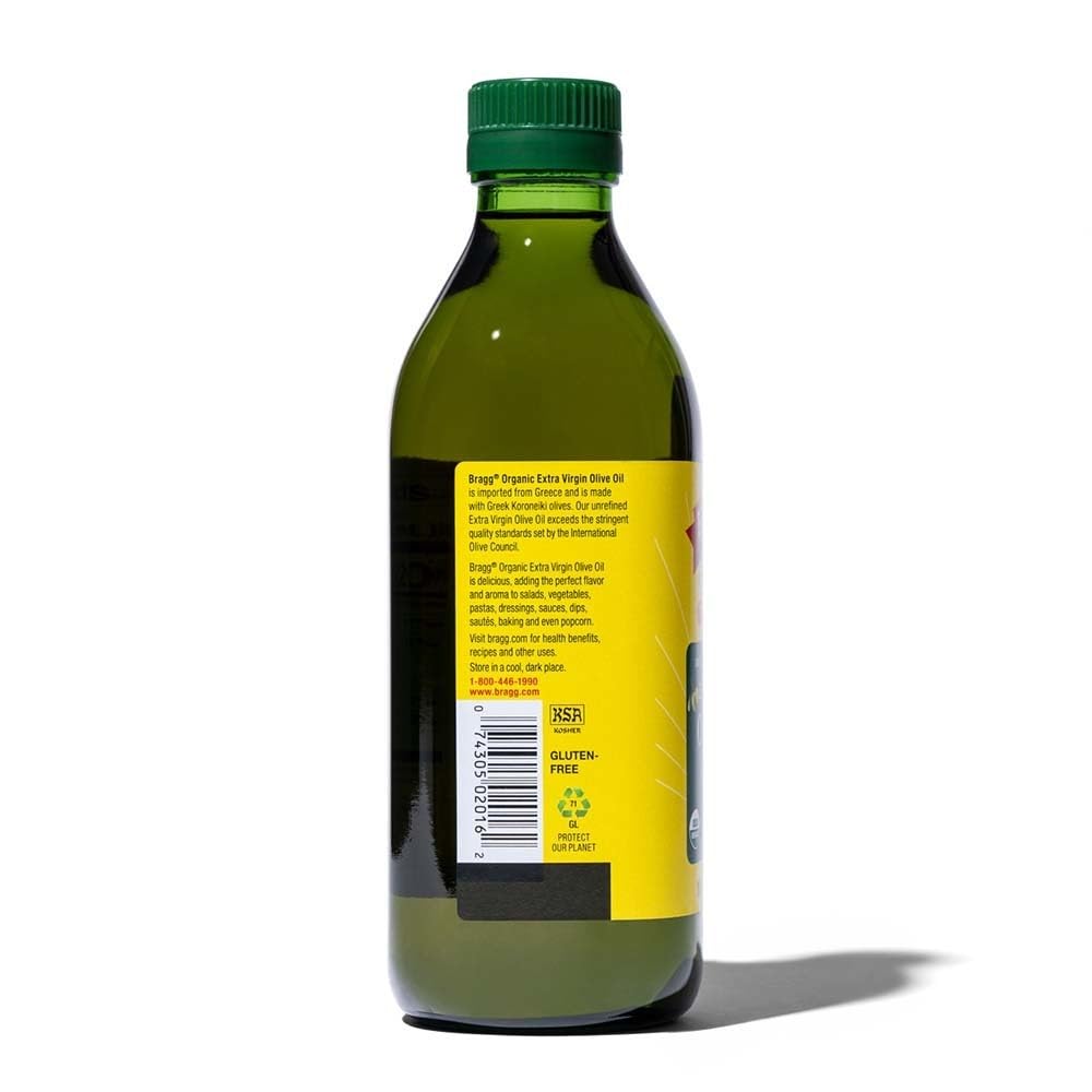 Bragg Organic Extra Virgin Olive Oil olive-branch closeup shows natural antioxidants for meals.