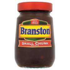 Branston pickle on a cheese sandwich, adding savory zest and crunch.