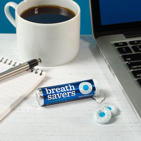 Breath Savers mint rolls in car or bag for portable freshness.