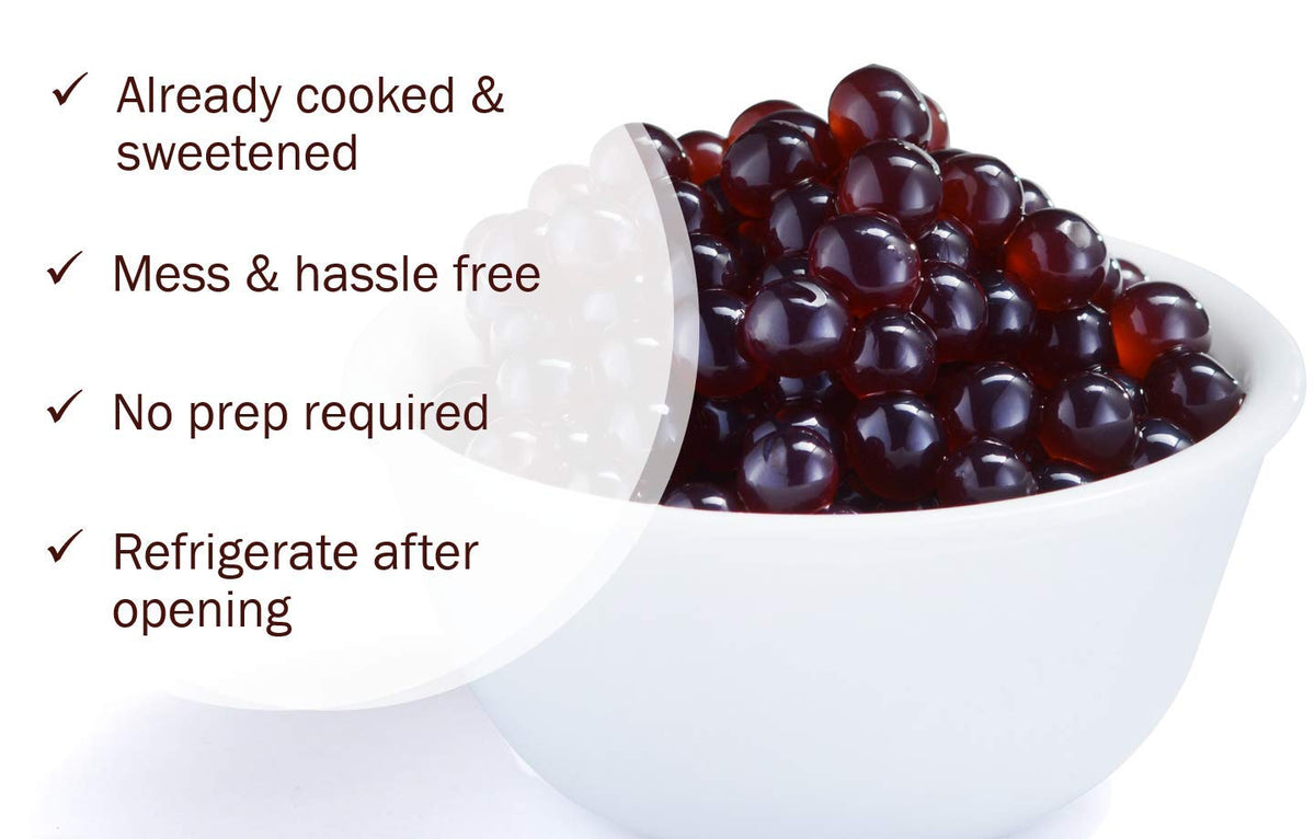 Close-up of bursting blueberry pearls releasing juice for bubble tea.