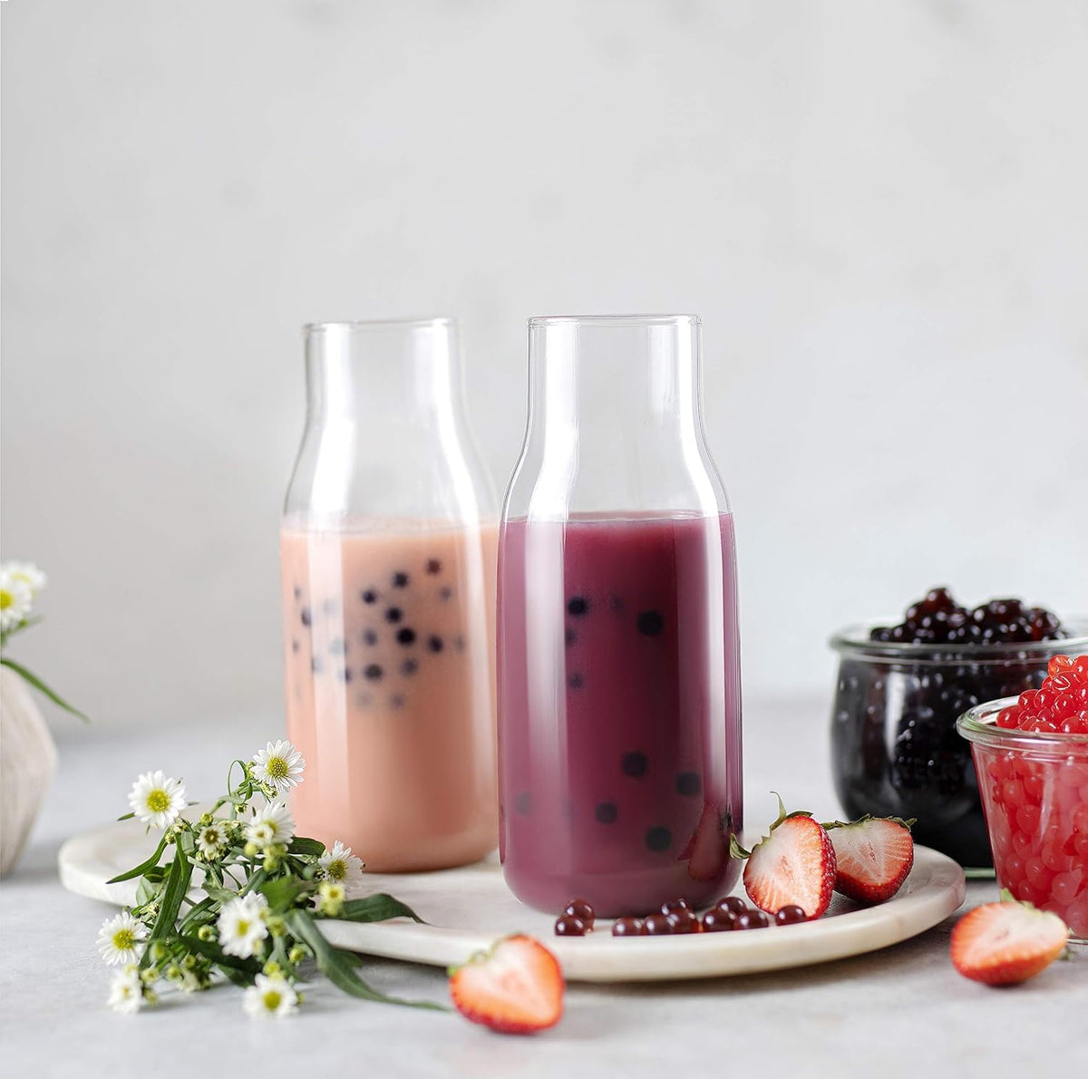 BREXONIC bursting boba mango tea ball over ice creates a tangy-sweet twist