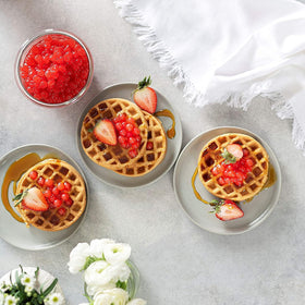 BREXONIC popping boba pearls used as a dessert topping for waffles and ice cream