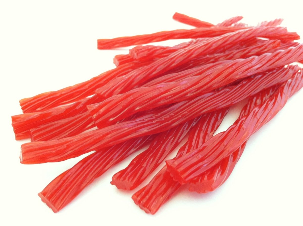 Bricktown Goods Cherry Licorice Twists closeup texture highlights soft, chewy bite for nostalgic snacking.