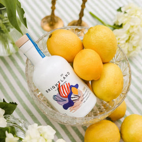 Brightland Lucid label artwork by B.D. Graft highlights lemon collage energy.