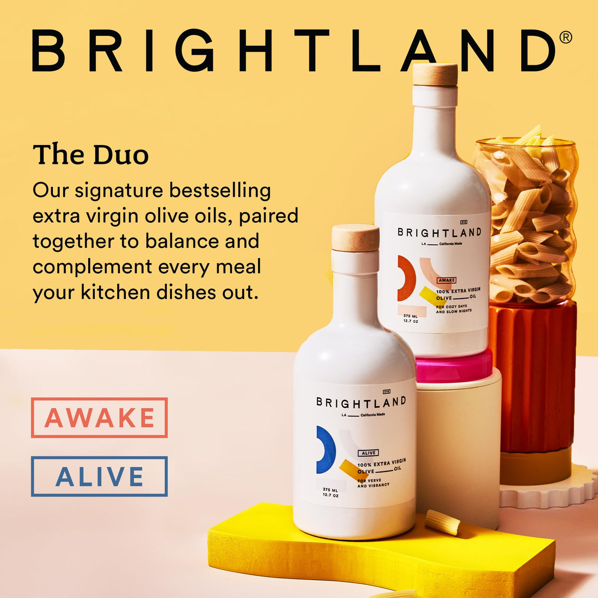 Brightland The Duo bottles on a kitchen counter, showing UV-protected glass packaging.