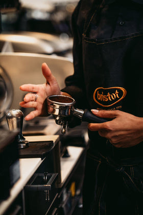 Bristot Speciale coffee grind closeup, highlighting oils and aroma in the grind