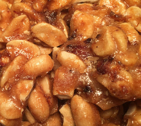 Brittle Brothers Bacon Peanut Brittle in kitchen scene — evokes warm, homemade aroma.