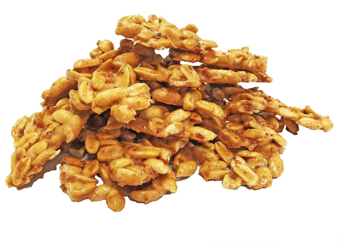 Brittle Brothers Bacon Peanut Brittle on plate — ready-to-share snack at gatherings.