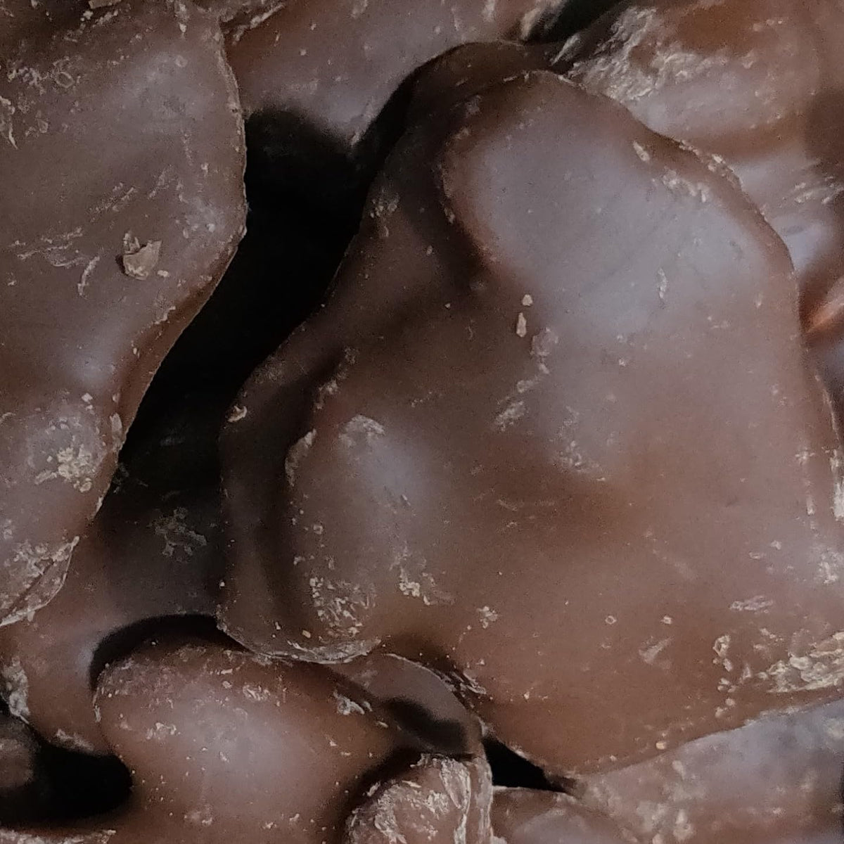 Milk chocolate coating on crisp Brittle Brothers brittle nuggets.