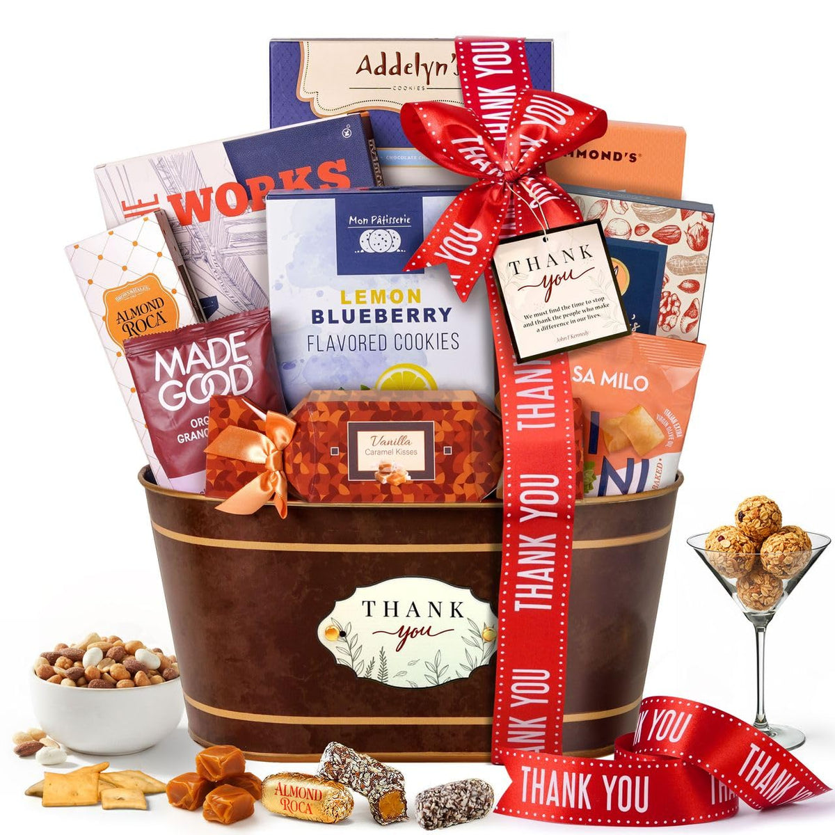 Broadway Basketeers thank-you gift basket assembly showing premium snacks ready to gift