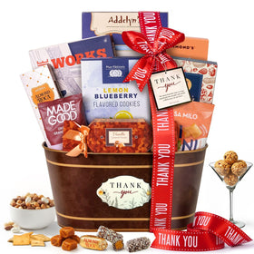 Broadway Basketeers thank-you gift basket assembly showing premium snacks ready to gift