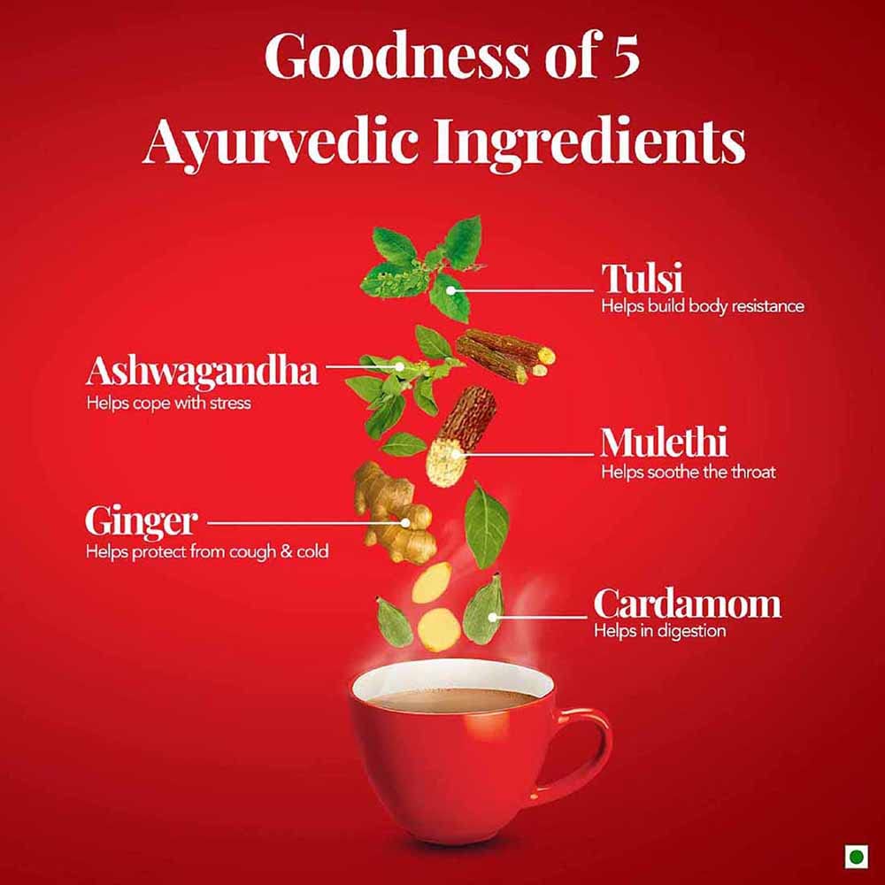 Pouring Brooke Bond Red Label Natural Care steeped tea with warm fragrance