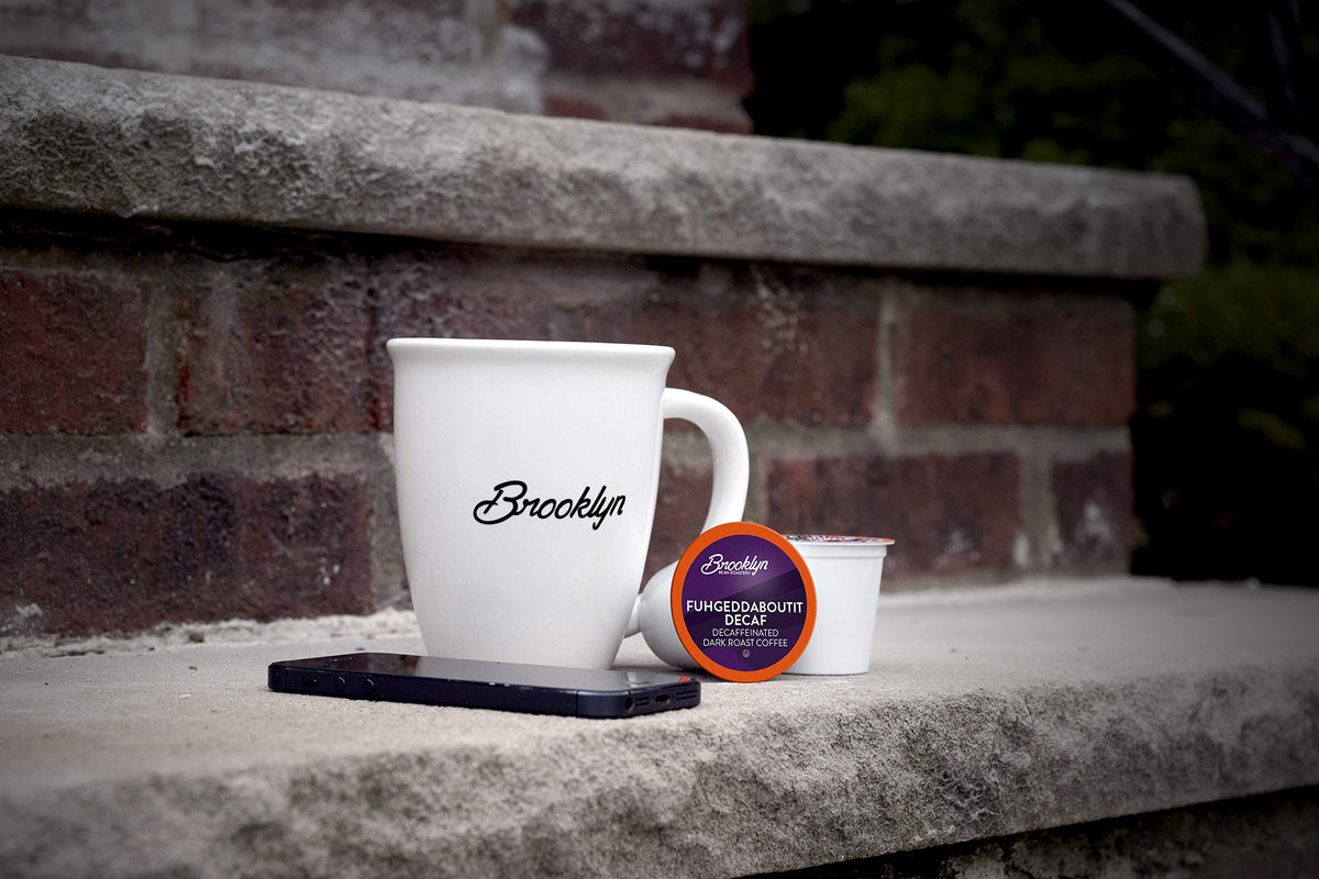Close-up of Brooklyn Beans Decaf pod highlighting deep roast notes and aroma.