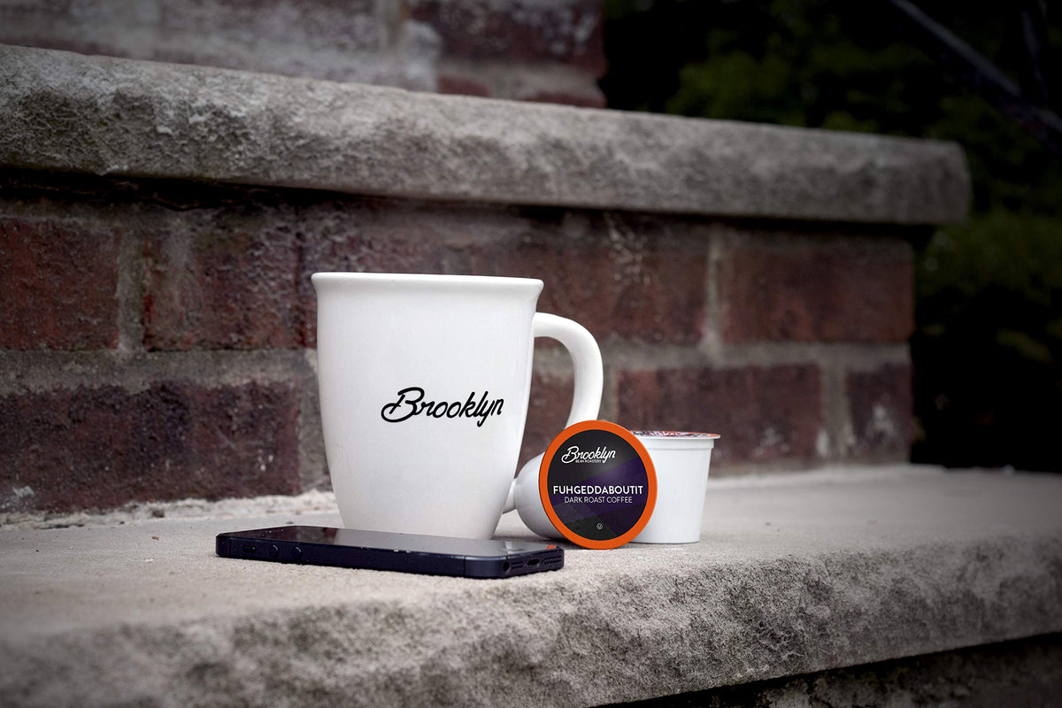 Brooklyn Beans Fuhgeddaboutit dark roast beans close-up highlighting rich color and oils.