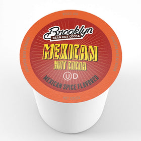 Steaming cup with Brooklyn Beans Mexican Cocoa pods conveys quick, comforting hot chocolate