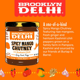 Brooklyn Delhi Spicy Mango Chutney scoop beside cheese board for pairing ideas.