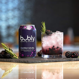 Bubly cans stacked for recycling emphasizes sustainable packaging.