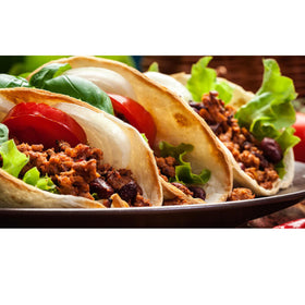 Buena Vida Chili Powder on a prepared beef taco, highlighting bold Mexican flavor.
