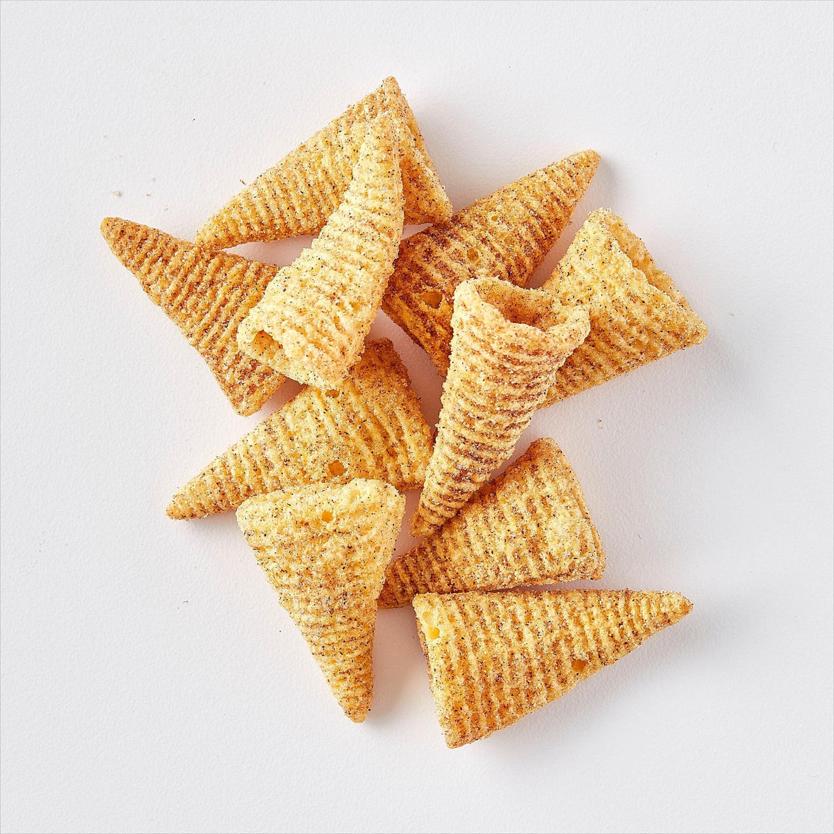 Bugles Sweet and Salty Churro close-up with cinnamon sugar dust for crunch.