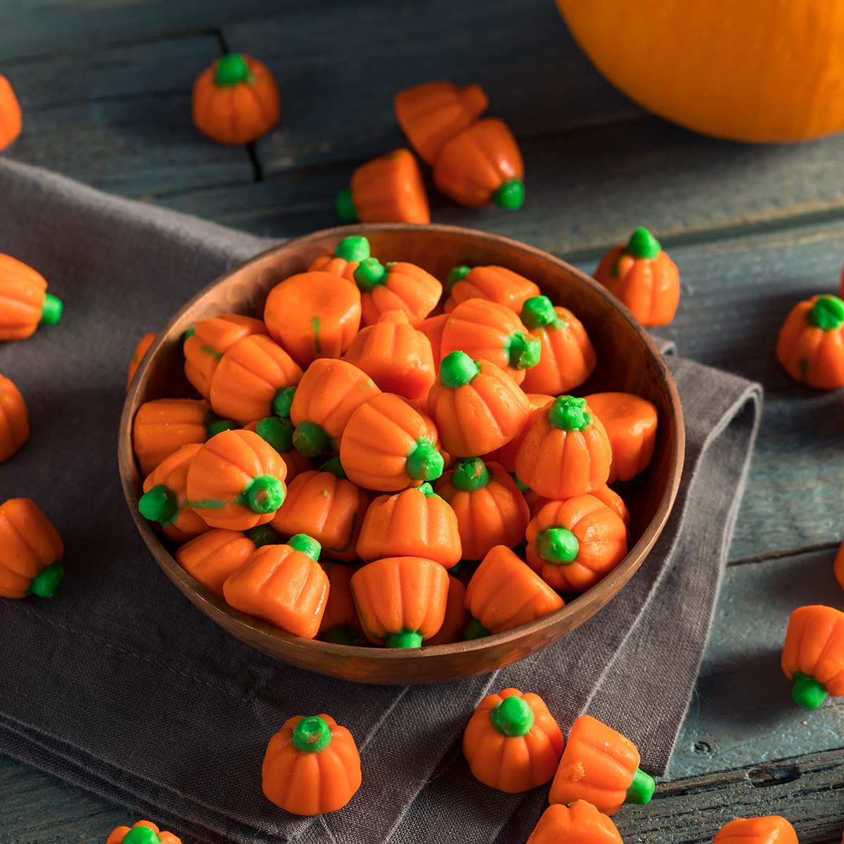 Vibrant pumpkins filling goodie bags during Halloween celebrations
