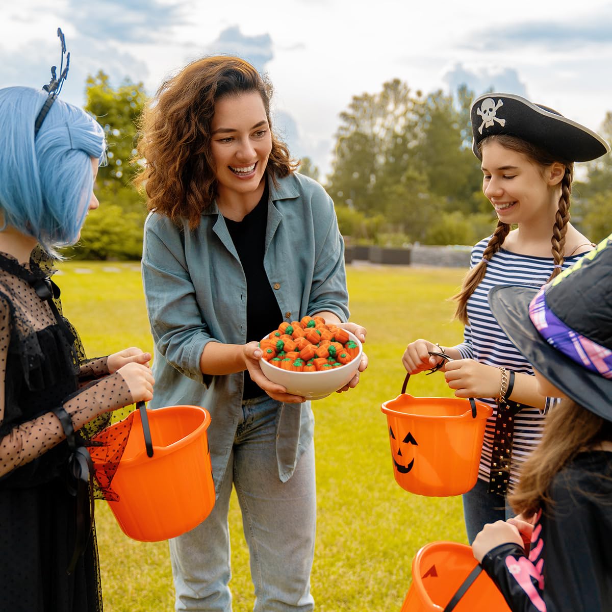 Kids and adults selecting Mellowcreme pumpkins for trick-or-treating