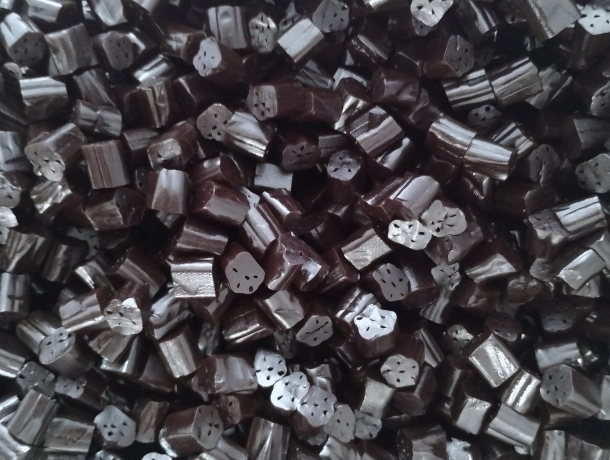 Gourmet Black Licorice Bites close-up shows glossy licorice richness.