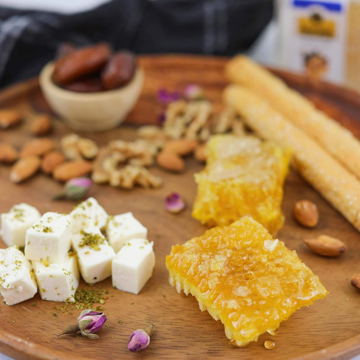 Buram honeycomb on salads adds texture and floral sweetness to greens.