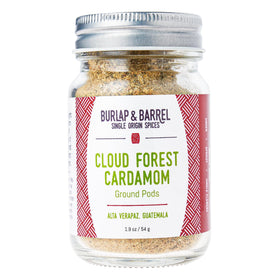 Burlap and Barrel Cloud Forest Cardamom pods in glass jar add bright flavor to desserts.