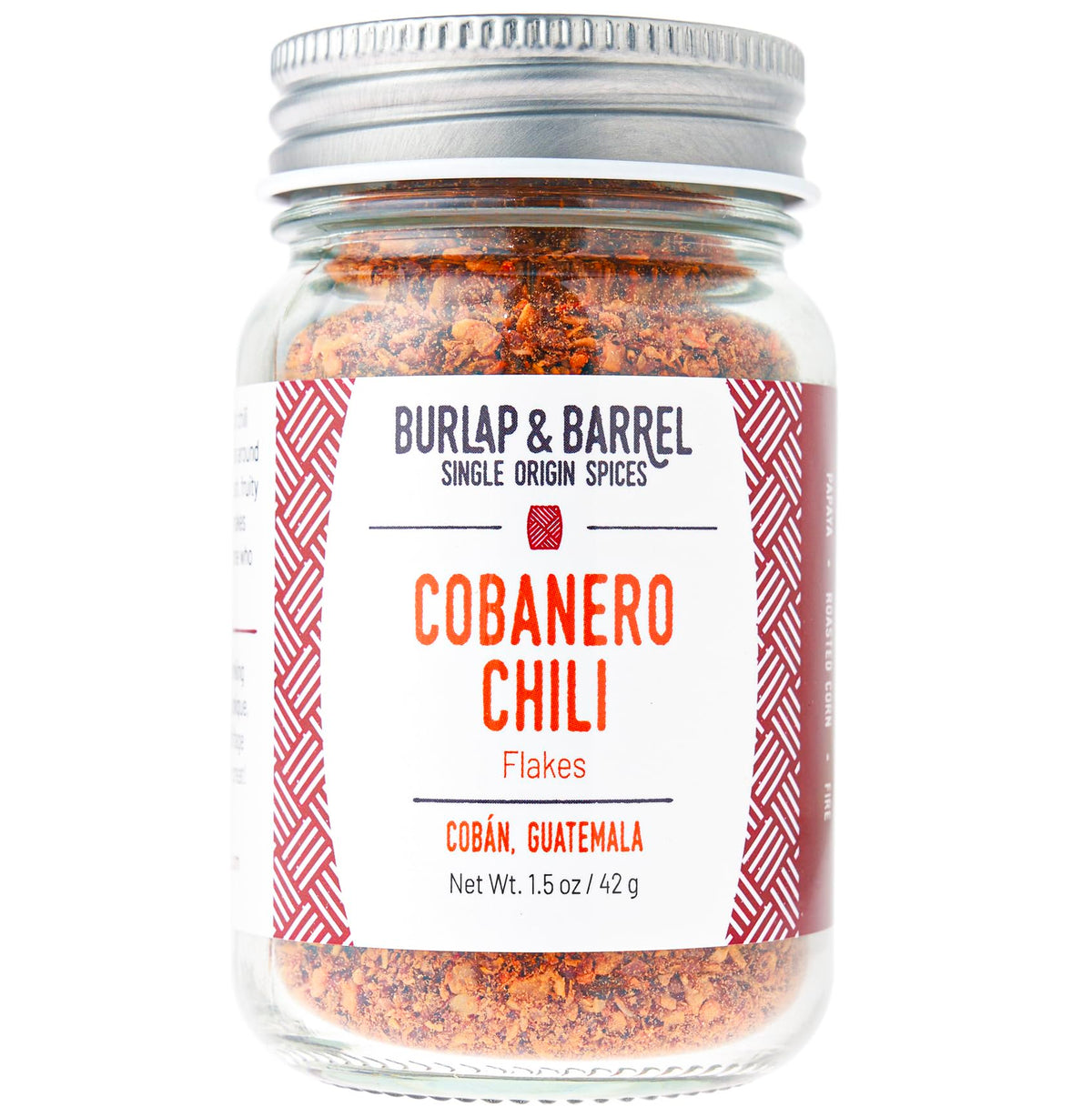 Burlap and Barrel Cobanero chili flakes in a glass jar for smoky heat.