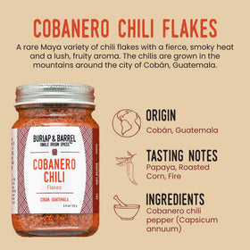 Pouring Cobanero flakes over a dish to add fruity aroma and spice.