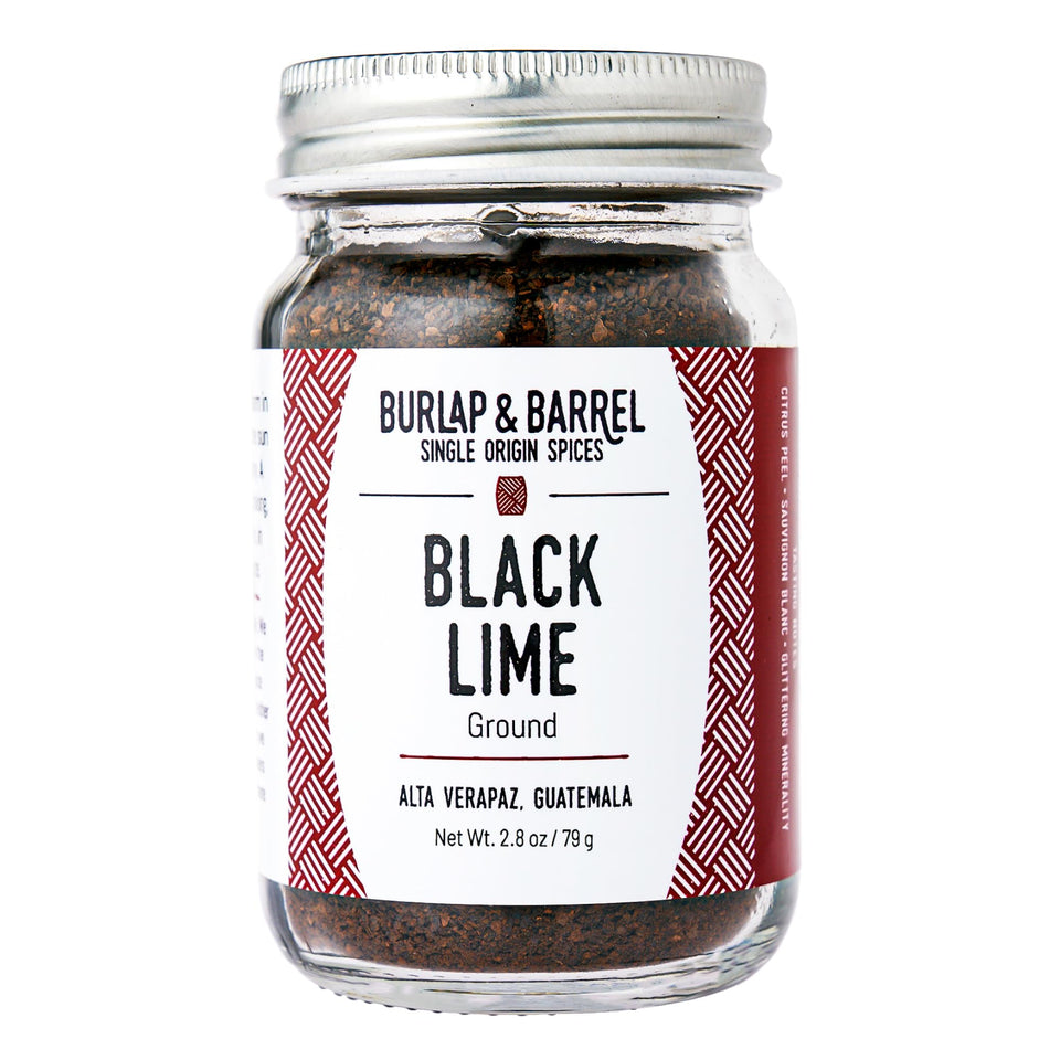Burlap & Barrel ground black lime jar front view showing powder texture for culinary brightness