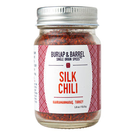 Burlap & Barrel Silk Chili Flakes jar close-up, elevating recipes with mild heat.