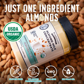 Glass of almond milk made from Burroughs concentrate for smoothies or coffee.