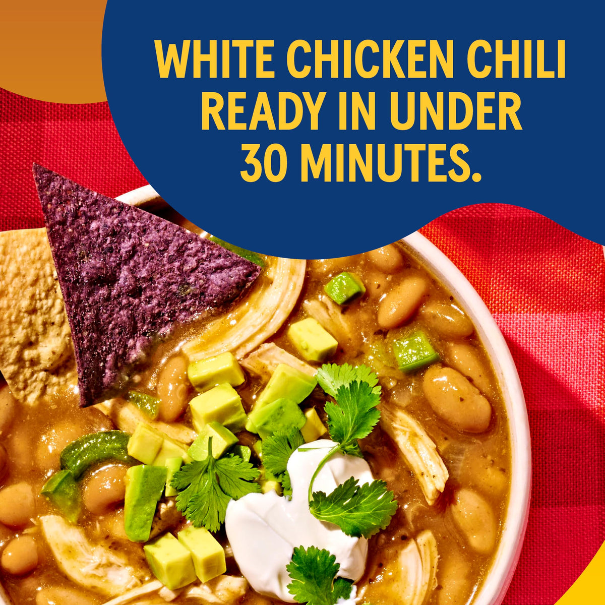 Simmering pan with Bush's Best White Chili Magic Starter offers cozy meal prep.