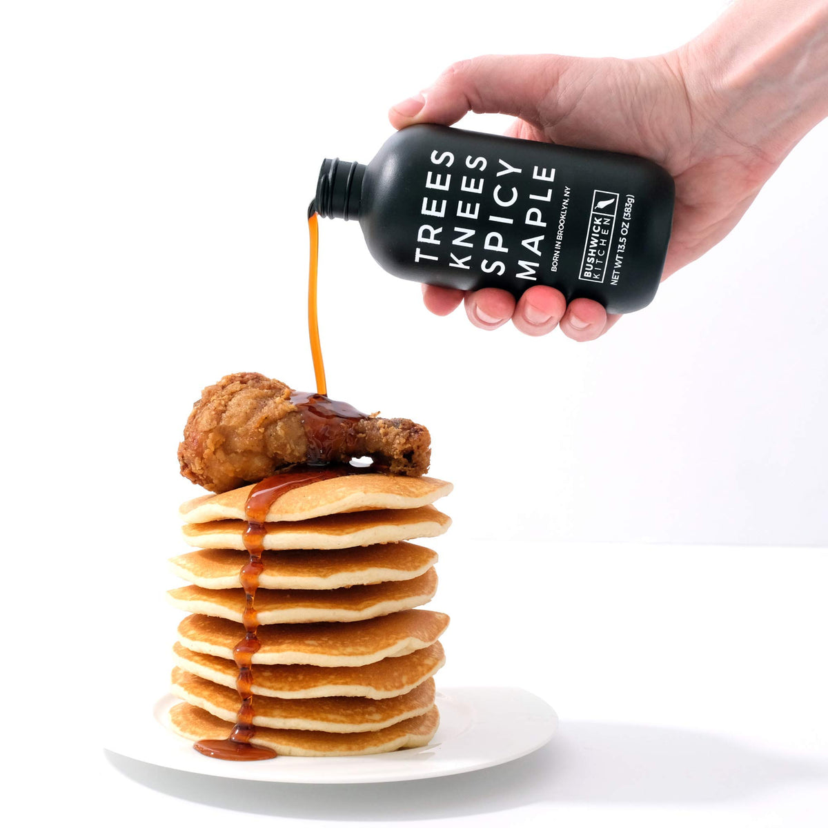 Glazing meat with Trees Knees Spicy Maple Syrup for depth and balance