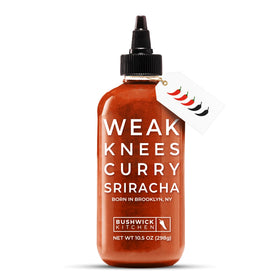 Bushwick Kitchen Weak Knees Curry Sriracha bottle for bold, versatile flavor.