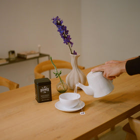 Bushwick Tea ingredients spread highlight ginger root and turmeric for a warming herbal base.