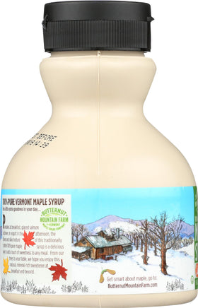 Butternut Mountain Farm Rich Amber Maple Syrup glass jar with wood background