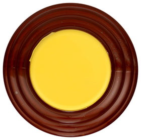 Buzzn Bee orange blossom honey pours into a spoon