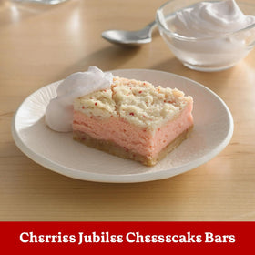 Betty Crocker Delights cherry chip cake slice plated with frosting