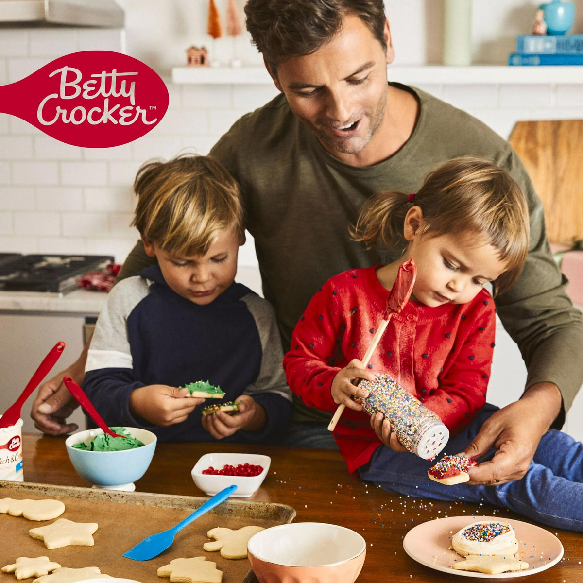 Betty Crocker Delights three-pack cake mix boxes on kitchen counter